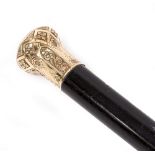 A VICTORIAN WALKING CANE with chased and engraved gilt metal finial, an inscription dated 25th