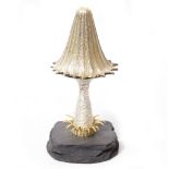 A CHRISTOPHER LAWRENCE PARCEL GILT SILVER TOADSTOOL mounted on a slate base, the toadstool lifting