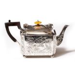 A VICTORIAN SILVER TEAPOT with engraved birds and foliate decoration, bearing marks for London,