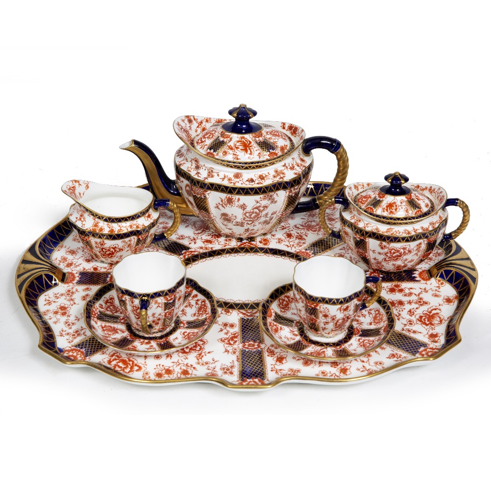 A ROYAL CROWN DERBY DUET TEASET in the Chatsworth pattern, consisting of a tray, a teapot, sugar