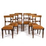 A SET OF SIX REGENCY STYLE BAR BACK DINING CHAIRS with carved horizontal splats and inset seats