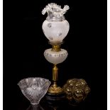 AN OLD OIL LAMP with glass shade, 61cm high together with two further glass light shades (3)