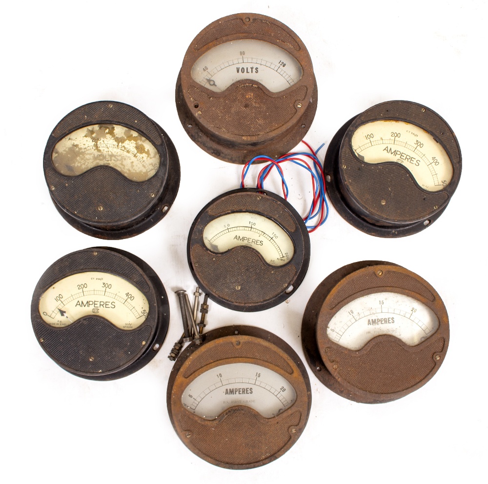 A GROUP OF SEVEN VARIOUS AMP AND VOLT METERS in circular cast iron cases