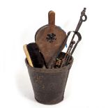 A VICTORIAN LEATHER FIRE BUCKET and a small quantity of fire tools to include bellows