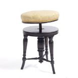 A VICTORIAN EBONISED PIANO STOOL with an upholstered adjustable seat and turned supports, stamped '