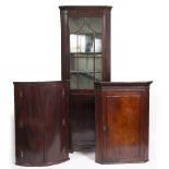 A MAHOGANY FLOOR STANDING CORNER CABINET with glazed upper section, 74cm wide x 203cm high