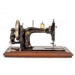 OLD PFAFF HAND CRANKED SEWING MACHINE in a burr wood box, 51cm wide x 28cm high x 26cm deep