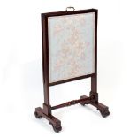 A 19TH CENTURY MAHOGANY METAMORPHIC FIRE SCREEN opening in three ways, the supports united by a