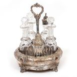 A SILVER CRUET CONDIMENT SET five cut glass bottles, one hallmarked, the bowl with marks for