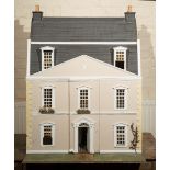 A GEORGIAN STYLE DOLLS HOUSE with folding/opening front, detachable mansard roof, pilastered hall,