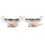 A PAIR OF SILVER SALTS in the form of oval classical urns, with looping handles, each with marks for