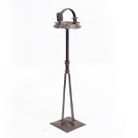A GERMAN ARTS AND CRAFTS STYLE SMOKING STAND with ashtray, candle holder and matchbox holder, 87cm
