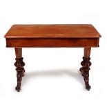 A VICTORIAN MAHOGANY CENTRE TABLE the rectangular top over two frieze drawers and standing on carved