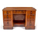 A VICTORIAN MAHOGANY INVERSE BREAK FRONT DRESSING TABLE OR DESK with central kneehole and seven