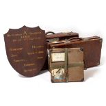 TWO BROWN LEATHER TRAVELLING TRUNKS belonging to Alan Villiers with various travel labels, the
