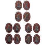 A SET OF TWELVE SGRAFFITO AND PAINTED OVAL PICTURES OF ROMAN EMPERORS on slate and within faux