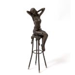 A BRONZE FIGURE OF A GIRL seated upon a bar stool, foundry plaque and impressed 'Pierre Collinet',