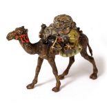 A COLD PAINTED BRONZE OF A HEAVY LADEN CAMEL indistinctly signed and numbered 35 beneath, 10.5cm