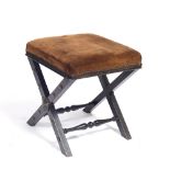 A LATE VICTORIAN EBONISED X FRAMED STOOL with upholstered square seat, 39cm wide x 40cm deep x