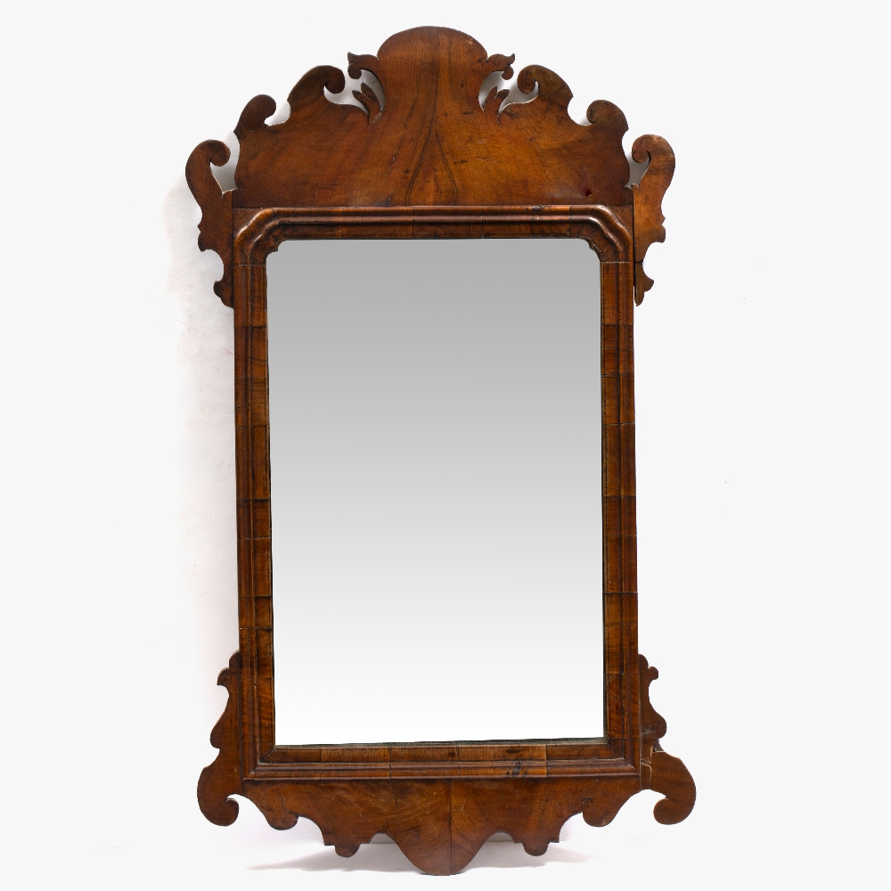 A GEORGE III WALNUT FRET FRAMED WALL MIRROR 43.5cm wide x 75.5cm high