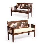 TWO SIMILAR ROSEWOOD SLATTED BENCHES 130cm wide x 64cm deep x 85cm high and 133cm wide x 64cm deep x