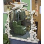 A LARGE HEAVILY CARVED WHITE PAINTED OVERMANTLE MIRROR with eagle crest and further decoratively