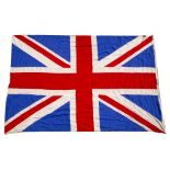 A LARGE UNION FLAG OR UNION JACK with brass fittings and rope, 230cm x 370cm