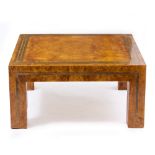 AN ART DECO STYLE LAMINATED BURR SATINWOOD VENEERED COFFEE TABLE with a brass inlaid border, 82cm
