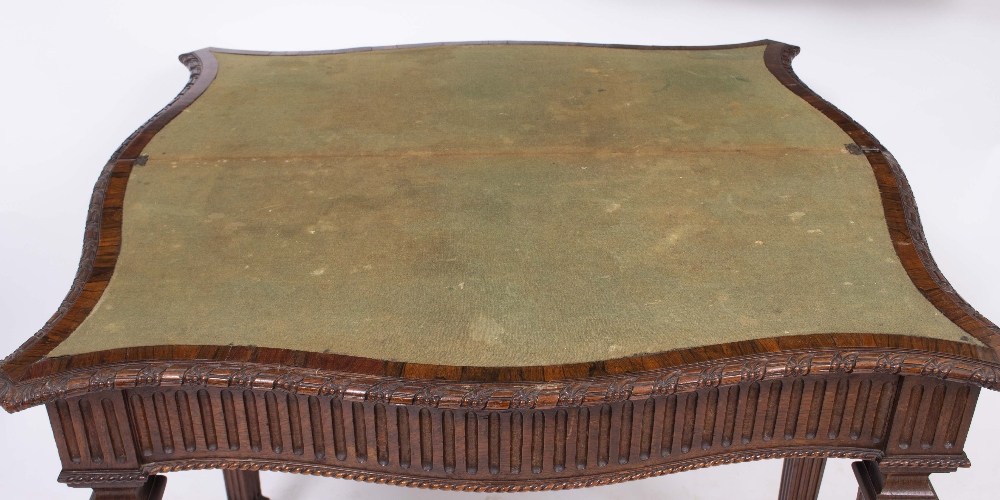 A 19TH CENTURY GEORGIAN STYLE ROSEWOOD SERPENTINE FOLD OVER CARD TABLE with fluted frieze and square - Image 2 of 2