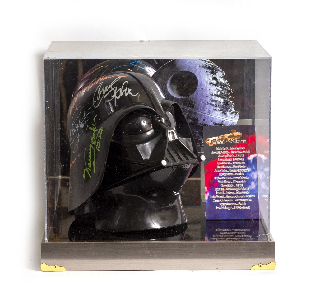 A SIGNED STAR WARS DARTH VADER REPLICA HELMET by members of the cast and George Lucas, mounted in