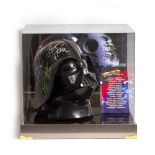 A SIGNED STAR WARS DARTH VADER REPLICA HELMET by members of the cast and George Lucas, mounted in