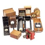 A GROUP OF VARIOUS WOODEN CASED METERS together with an old electric motor and a Russian air