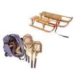 TWO WOODEN SLEDGES with metal runners one named 'Davos', four wooden tennis racquets and two