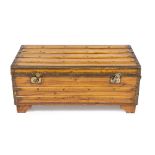 A CAMPHOR WOOD BRASS BOUND TRUNK with carrying handles to the side, 100cm wide x 55cm deep x 43cm