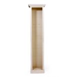 A TALL NARROW WHITE PAINTED BOOKCASE on a plinth base, 44cm wide x 26cm deep x 208cm high (shelves