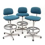 A SET OF THREE BLUE UPHOLSTERED RETRO HIGH CHAIRS by Herman Miller with adjustable seats, backs