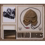 A HOWARD HUGHES SIGNED AVIATOR'S FLIGHT CAP mounted in a display measuring 81cm x 67cm