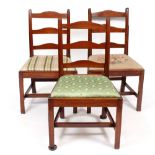 A SET OF THREE 19TH CENTURY MAHOGANY LADDER BACK DINING CHAIRS with inset seats