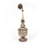 A 19TH CENTURY INDIAN WHITE METAL ROSEWATER SPRINKLER 26cm in height