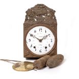 A 19TH CENTURY FRENCH PRESSED BRASS AND TOLEWARE WALL CLOCK with a bell, pendulum and weight, the