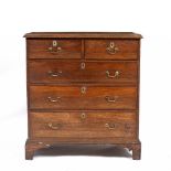 AN EARLY 19TH CENTURY ELM CHEST OF TWO SHORT AND THREE LONG DRAWERS with swan neck handles and