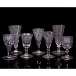 AN ANTIQUE DWARF ALE FLUTE together with six further decorative glasses (7)