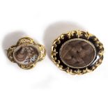 TWO 19TH CENTURY MEMORIAL BROOCHES the first designed as an oval black panel with foliate scroll