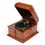 A PAIN'S OAK CASED GRAMOPHONE RECORD PLAYER with winding handle to the side and hinged doors to
