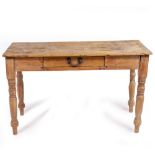 A VICTORIAN PINE SIDE TABLE with a rectangular top, a single frieze drawer and turned supports,