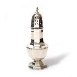 A GEORGIAN STYLE SILVER SUGAR CASTER of octagonal baluster form, marks for Birmingham 1912, 21.5cm