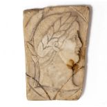 AN ANTIQUE ALABASTER PLAQUE with a carved head and shoulder relief, 9.5cm x 7cm