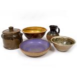 A GROUP OF FIVE STUDIO POTTERY EARTHENWARES to include a jug, three bowls, a shallow bowl and a