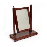 A 19TH CENTURY MAHOGANY DRESSING TABLE MIRROR the rectangular mirror plate on turned supports and