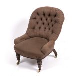 A VICTORIAN BUTTON UPHOLSTERED NURSING CHAIR with turned front legs terminating in brass and ceramic